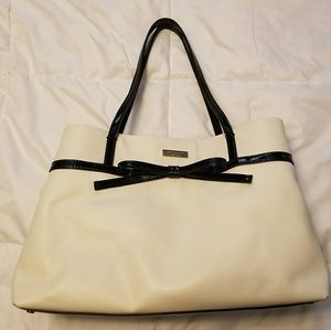 White Kate Spade bag with little black bow